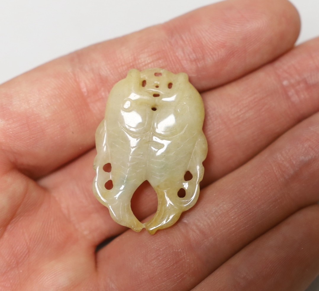 Three Chinese carved hardstone pendants